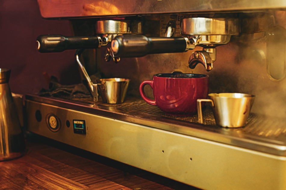 The espresso machine at Blackbird, pouring into a red cup