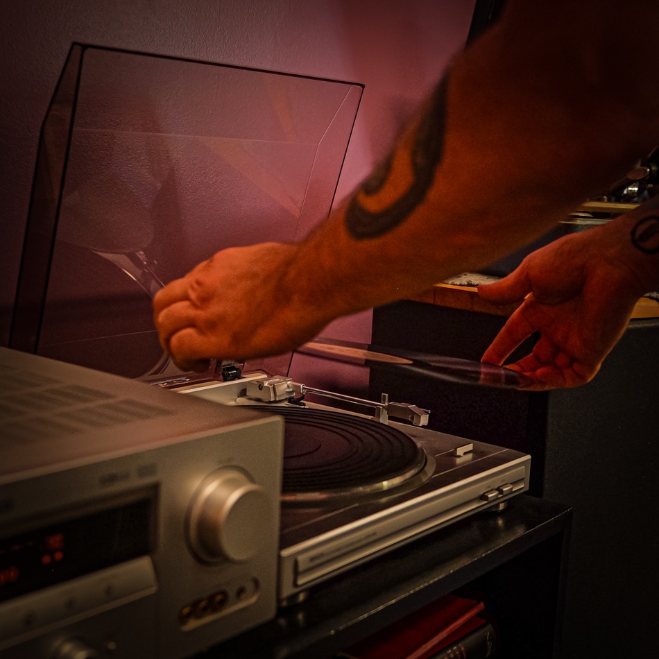 Cueing a record up on the turntable in the Blackbird listening lounge